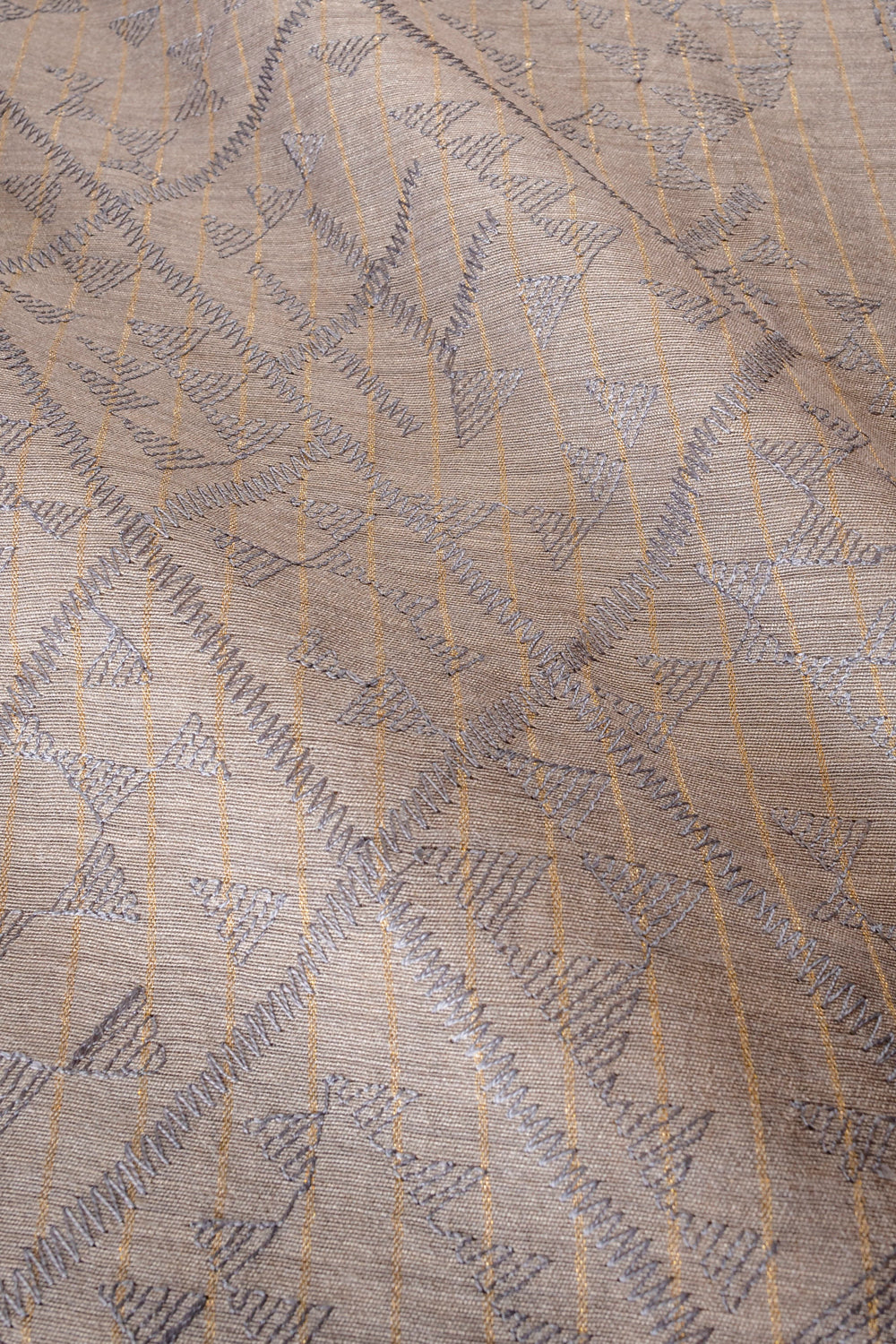 Handwoven grey embroidered muga silk fabric