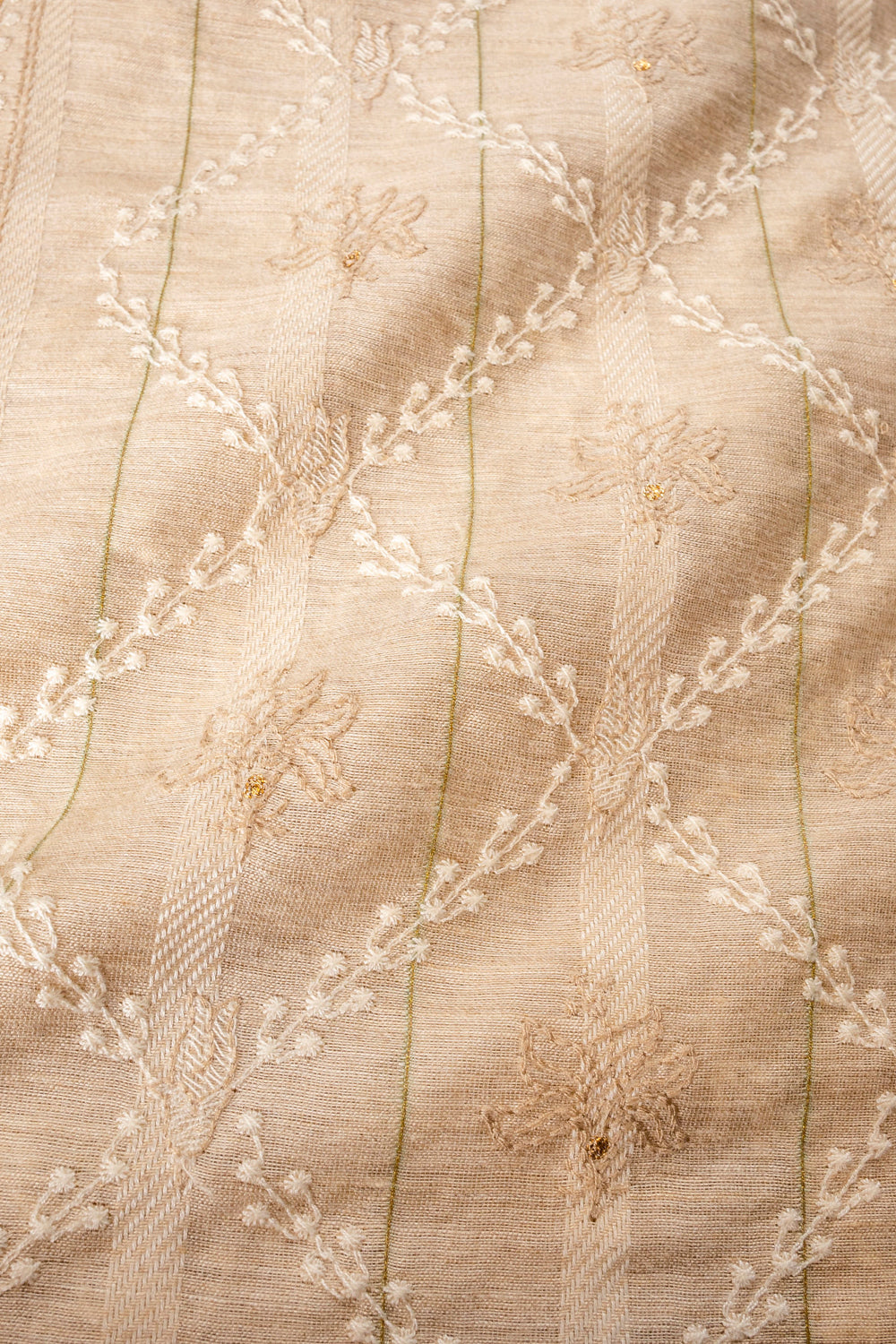 Handwoven beige embroidered muga silk fabric