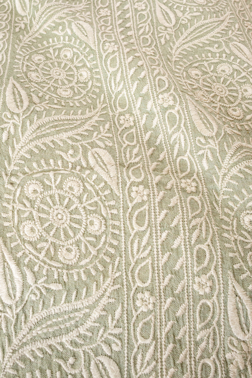 Handwoven sage green embroidered muga silk fabric