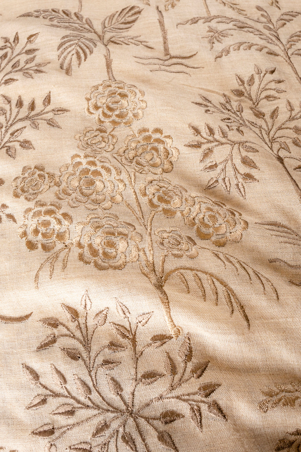 Handwoven beige embroidered muga silk fabric