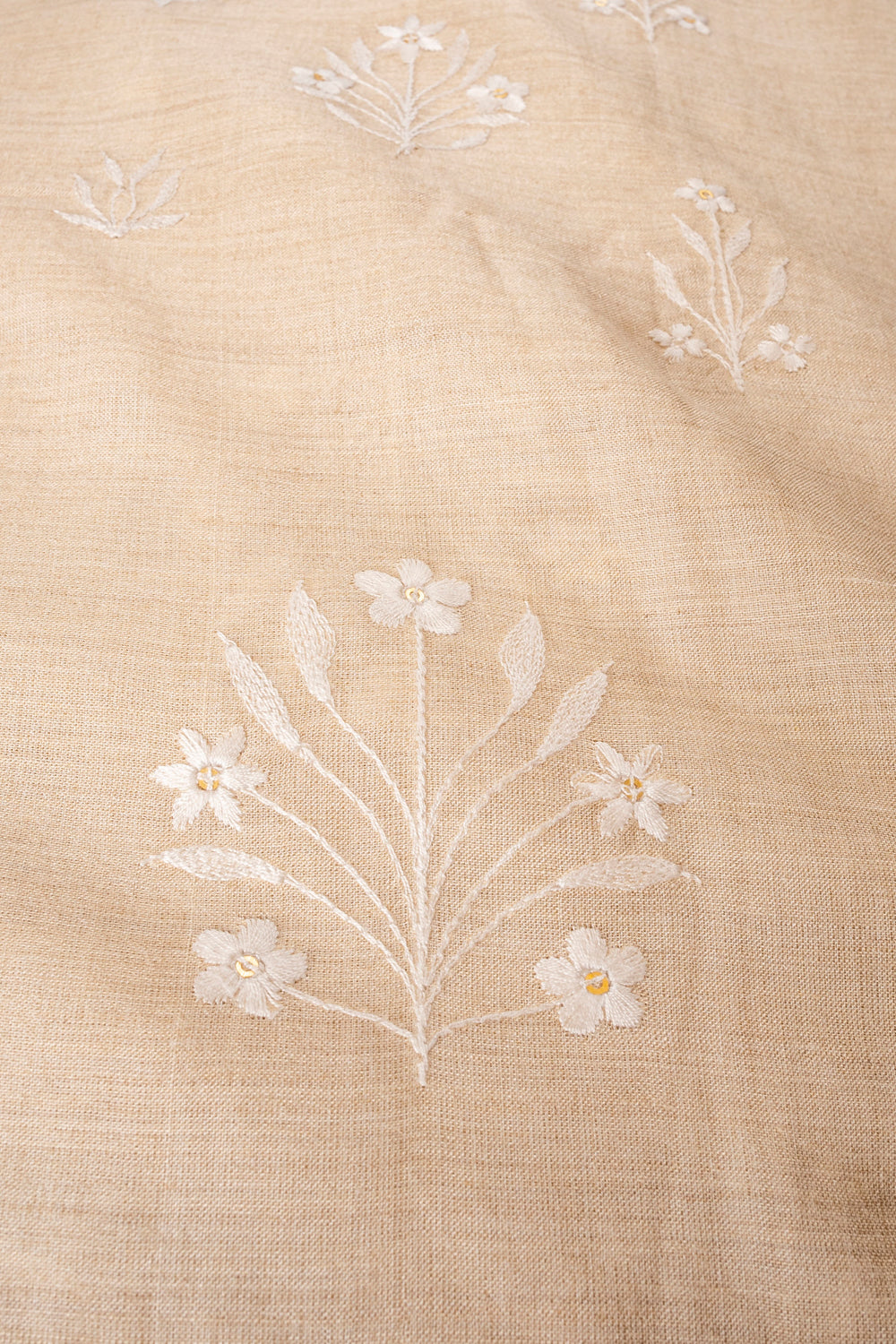 Handwoven cream embroidered muga silk fabric