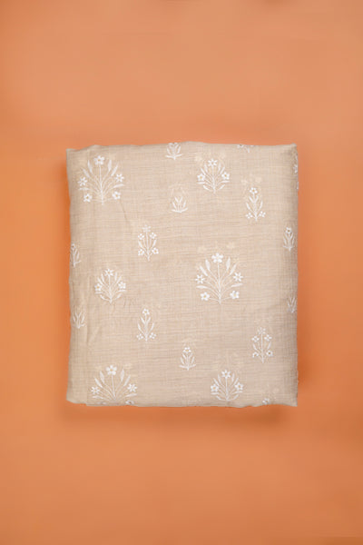 Handwoven cream embroidered muga silk fabric