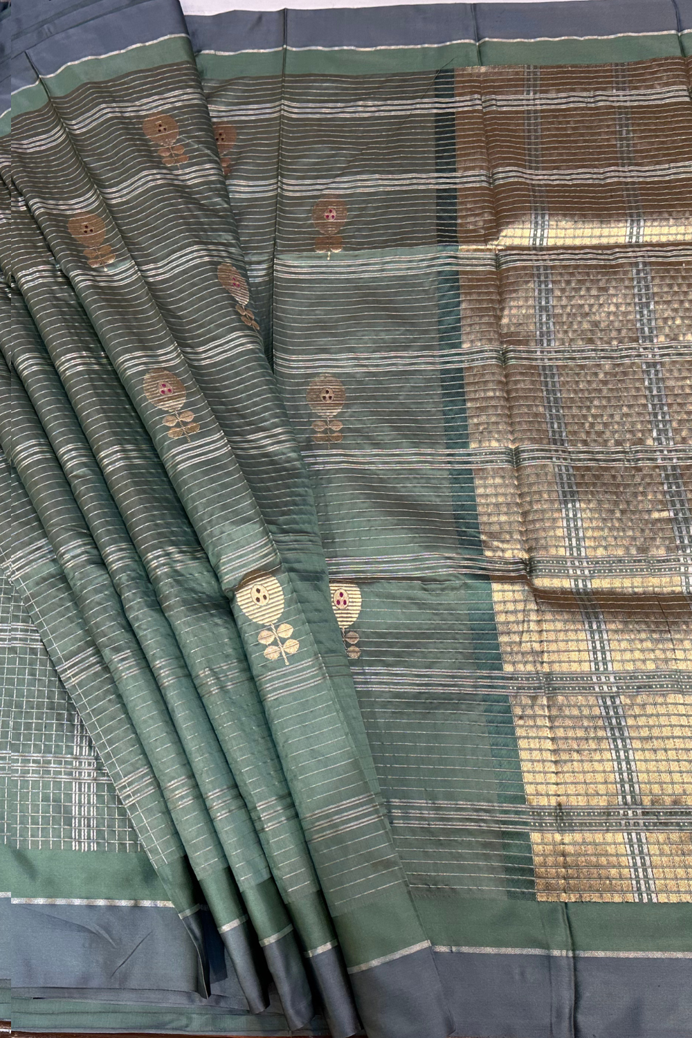 Handwoven sage green check pure silk saree