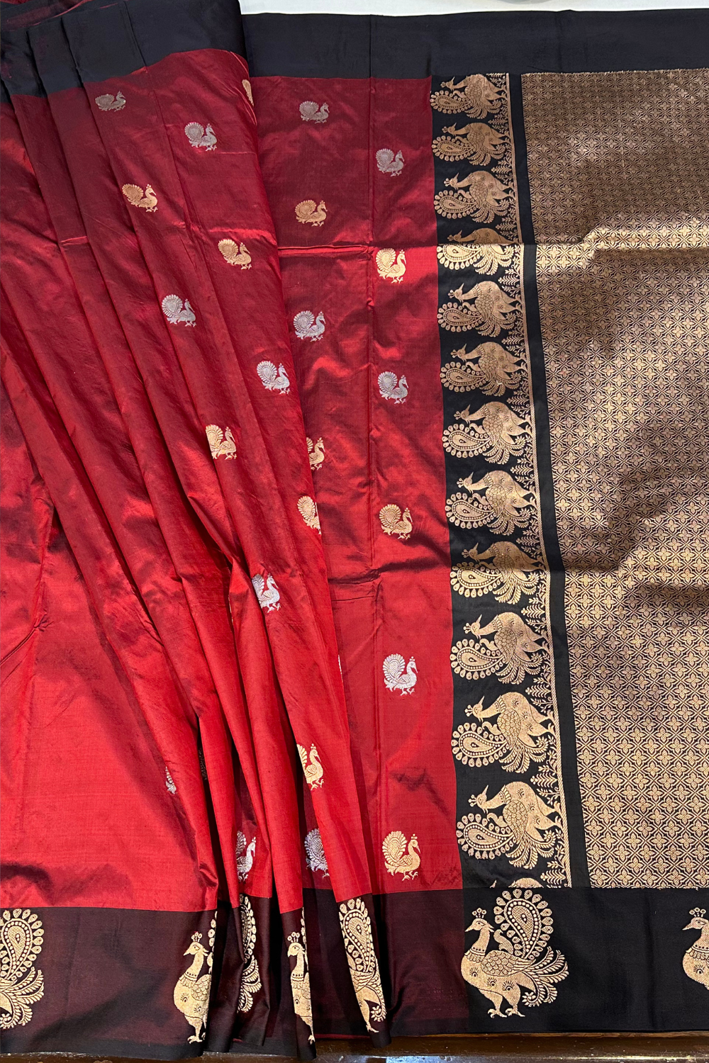 Handwoven deep red animal motif pure silk saree