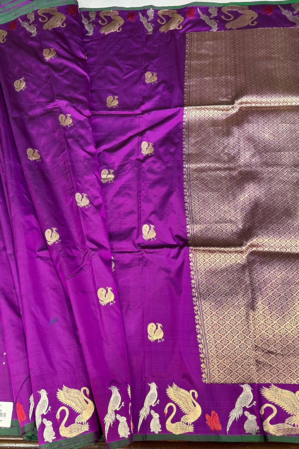 Handwoven purple animal motif pure silk saree