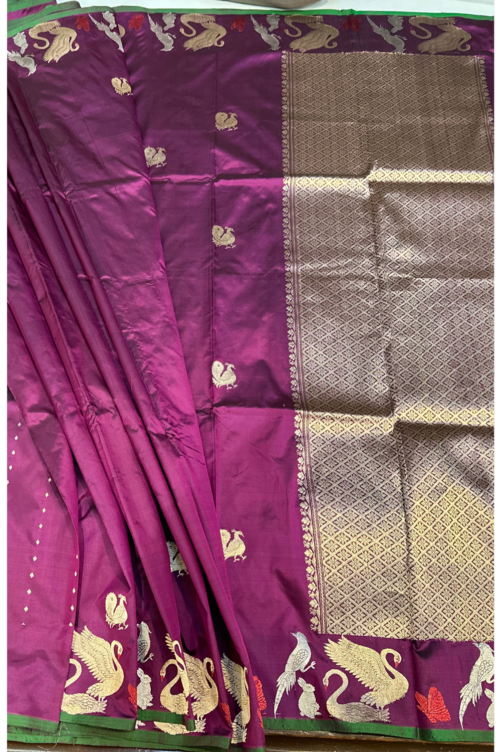 Handwoven wine animal motif pure silk saree