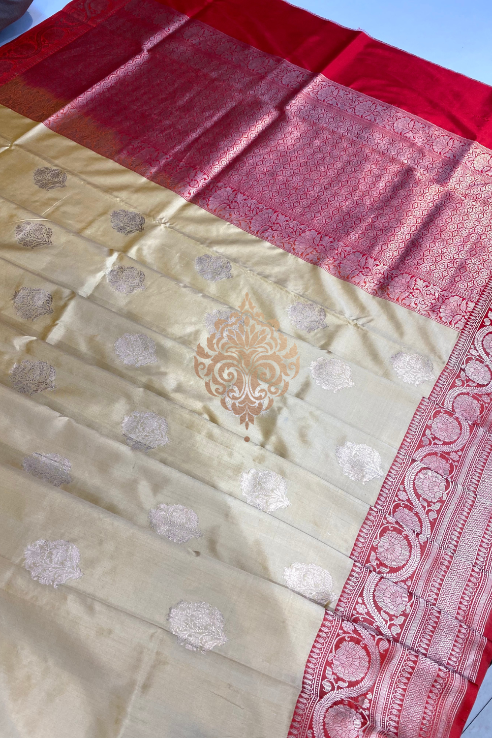 handwoven cream-red silk saree