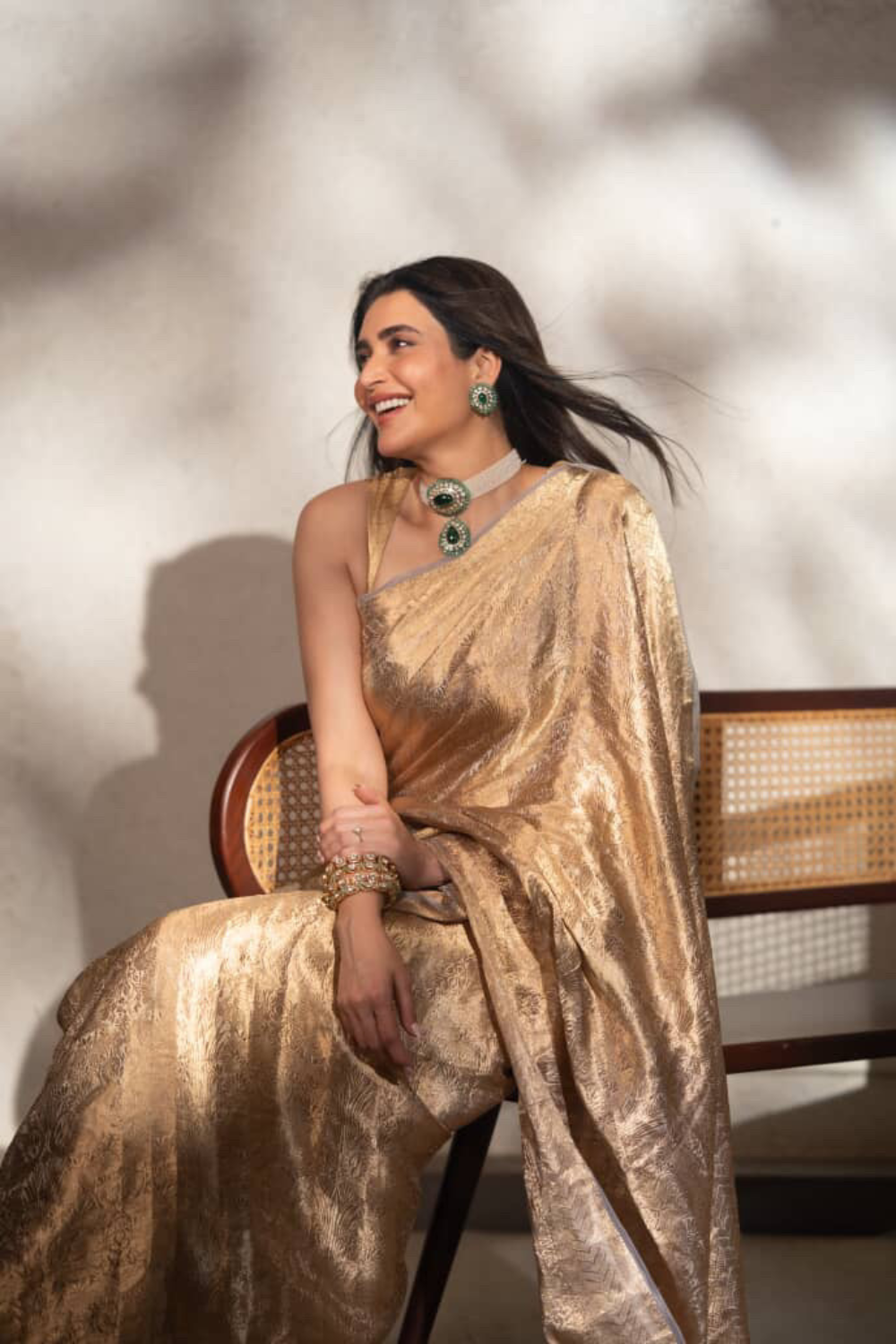 Karishma Tanna in our handwoven molten gold shikargah tissue saree