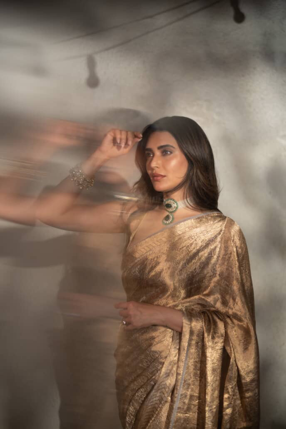Karishma Tanna in our handwoven molten gold shikargah tissue saree