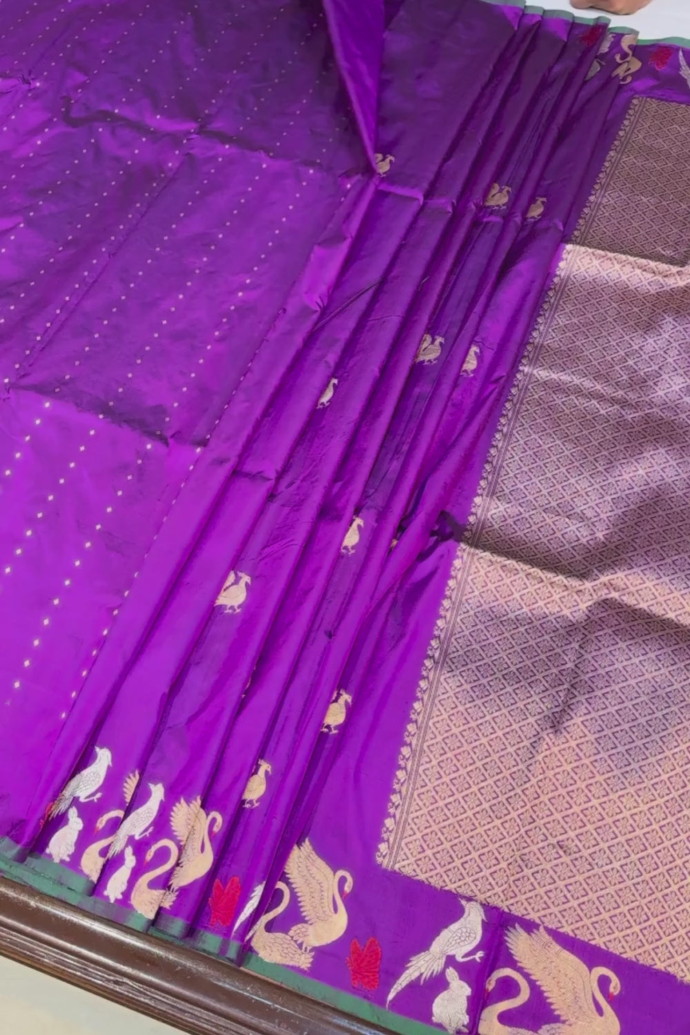 Handwoven purple animal motif pure silk saree